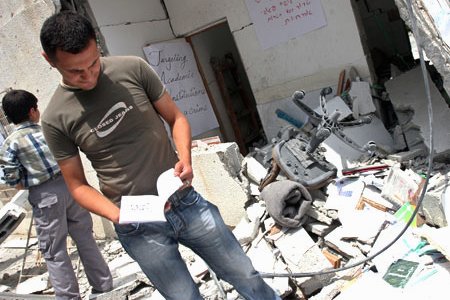 Students inspect the rubble of the Islamic University in Gaza. (MaanImages, Magnus Johansson), from freegaza.org